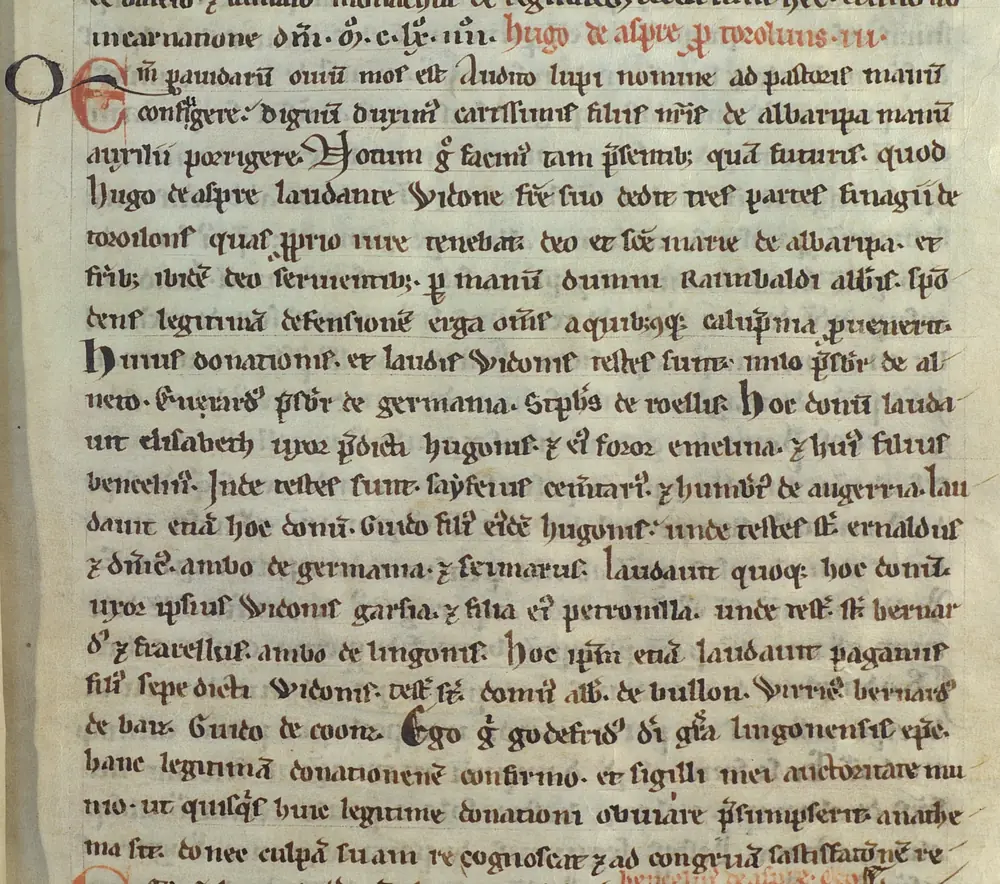 Page manuscrite du XIIe siècle à l'écriture gothique, avec rubriques rouges et initiale ornée